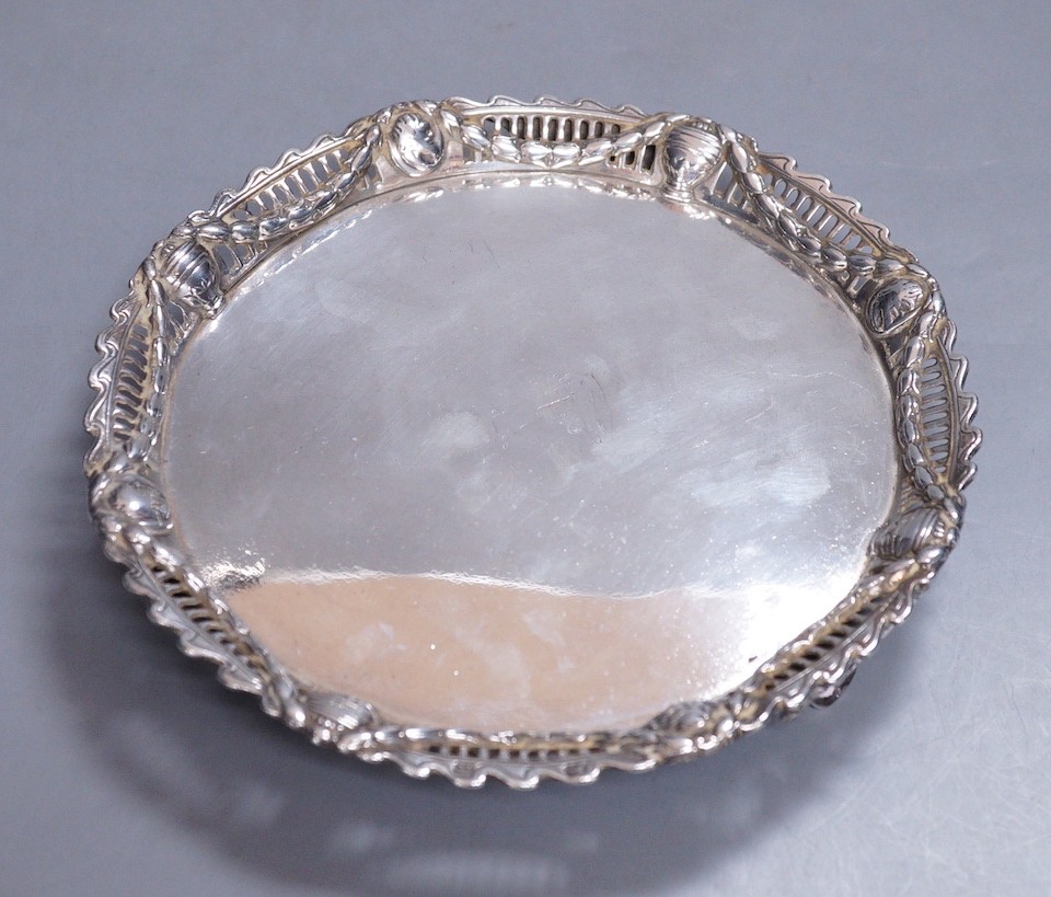 A George III silver waiter with applied pierced silver border, John Cox, London, 1771, 18.1cm, 11.9oz, with later engraved initials and date to the base, (a.f.).